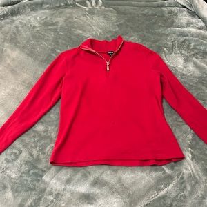 Red zip up long sleeve .